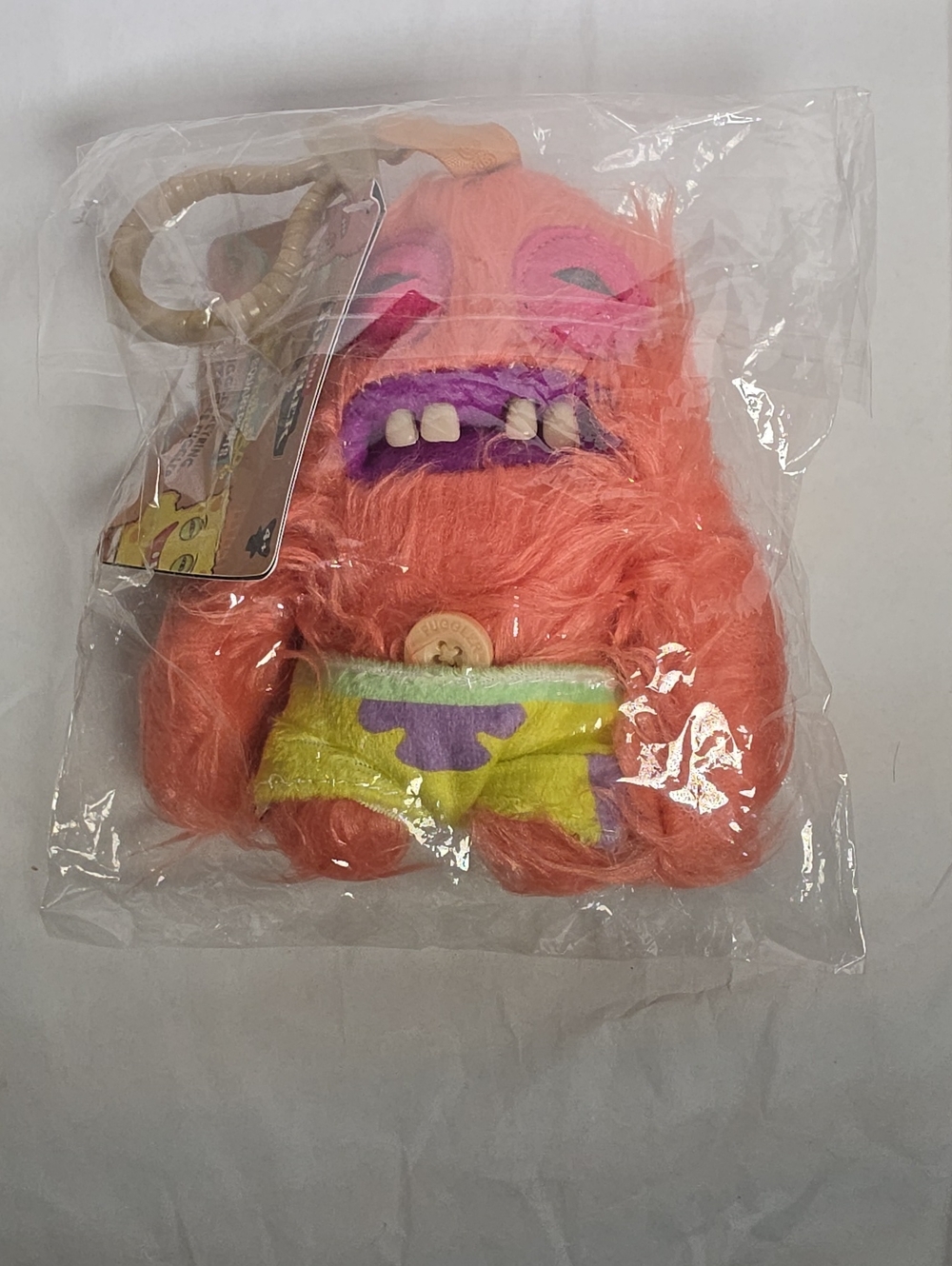 Pink Furry Monster Plush Toy – Cute Colorful Shorts